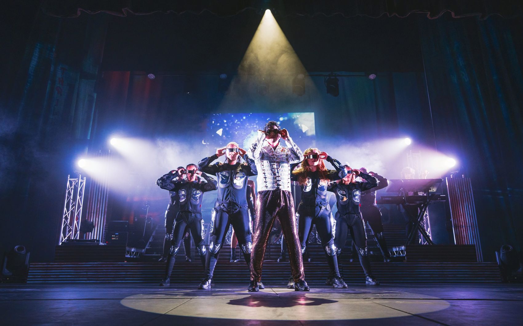 Forever Jackson — Michael Jackson tribute, dancers backlit in beams